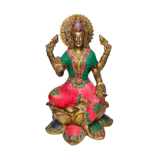 A Bronze Statue Of Lakshmi Sitting On A Lotus