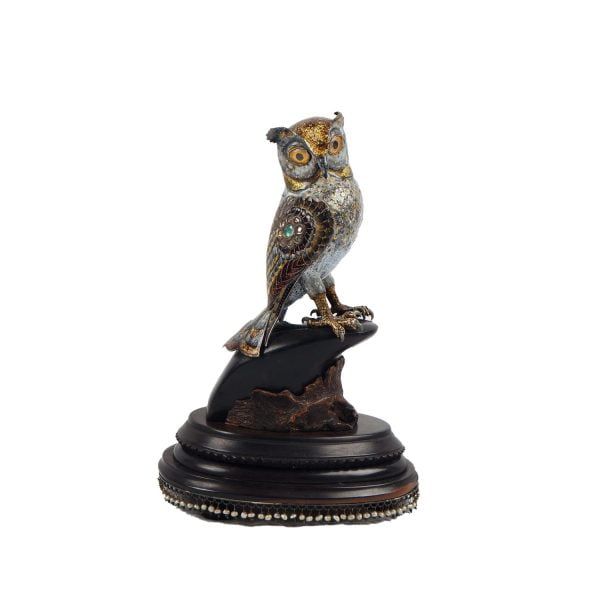 A figurine of antique mughal silver enamel owl set