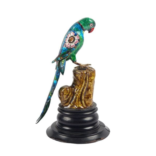 A figurine of mughal silver enamel parrot on ebony