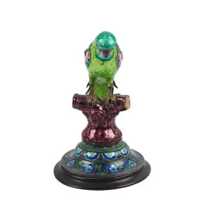 A figurine of mughal silver enamel parrot on ebony